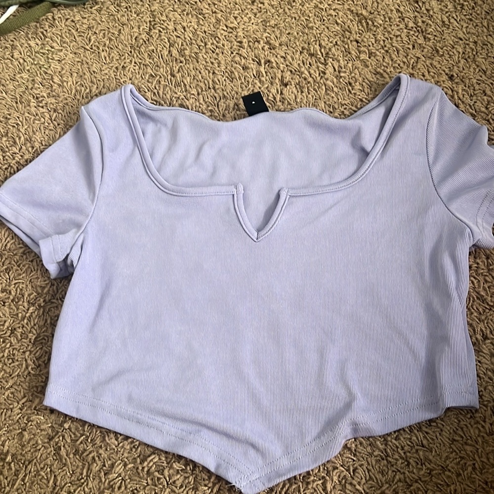 purple crop top kinda triangle at the bottom